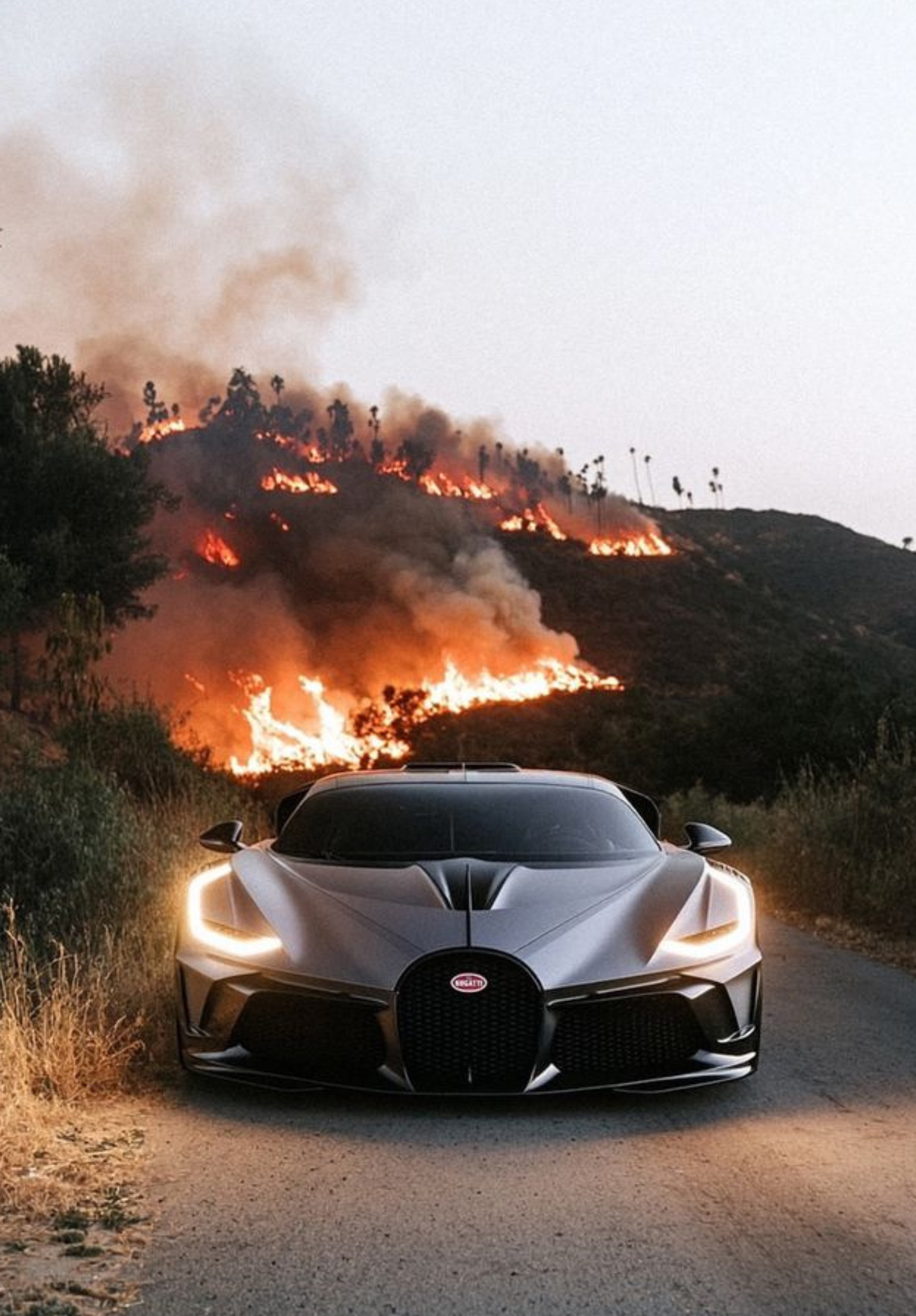 Bugatti with fire in the hills